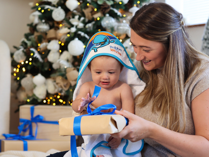 water babies baby with hooded towel and christmas present