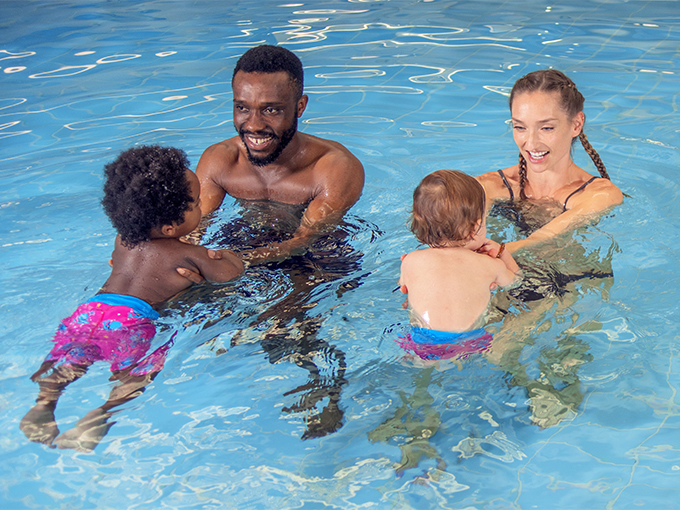 parents with toddlers in water babies lessons