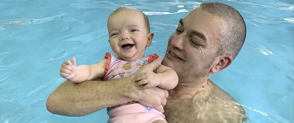 jo tantum sleep experts husband and baby in water babies lesson