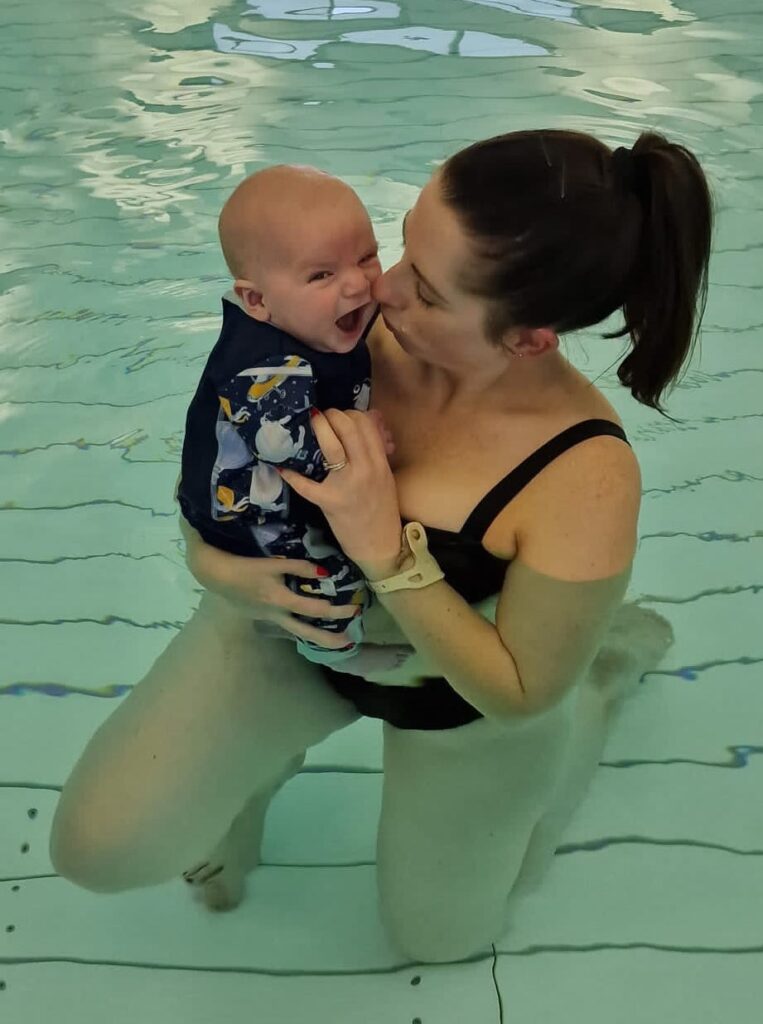 kelly and orson in the pool at a water babies lesson