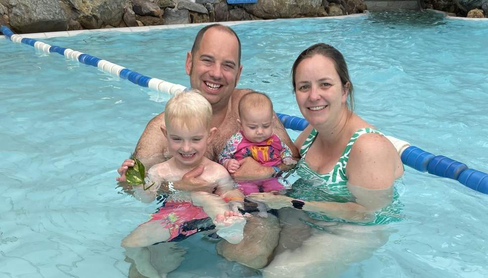 Parents Laura and Jamie Boswell with Ollie and sister Lily in the pool in Majorca