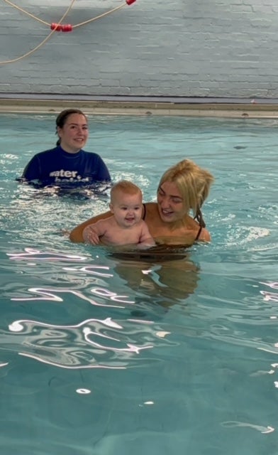 shannon and orlagh swimming in a water babies lesson