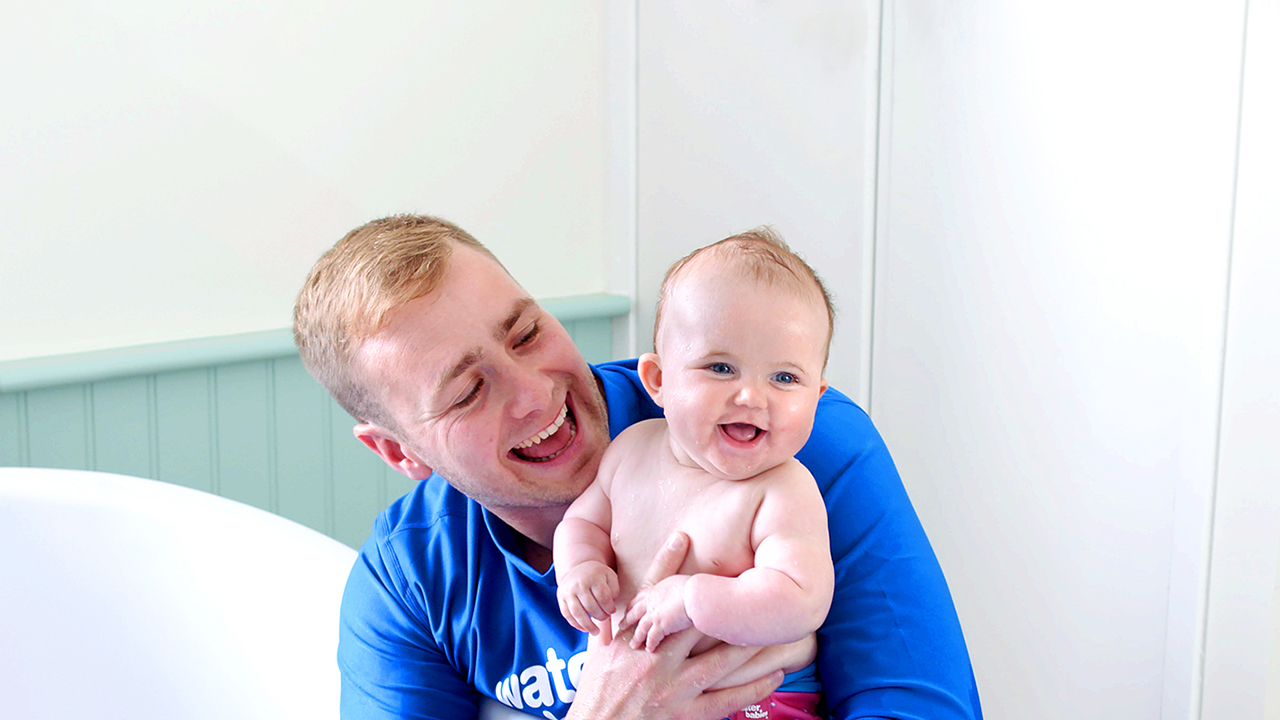 water babies teacher with baby in the bath