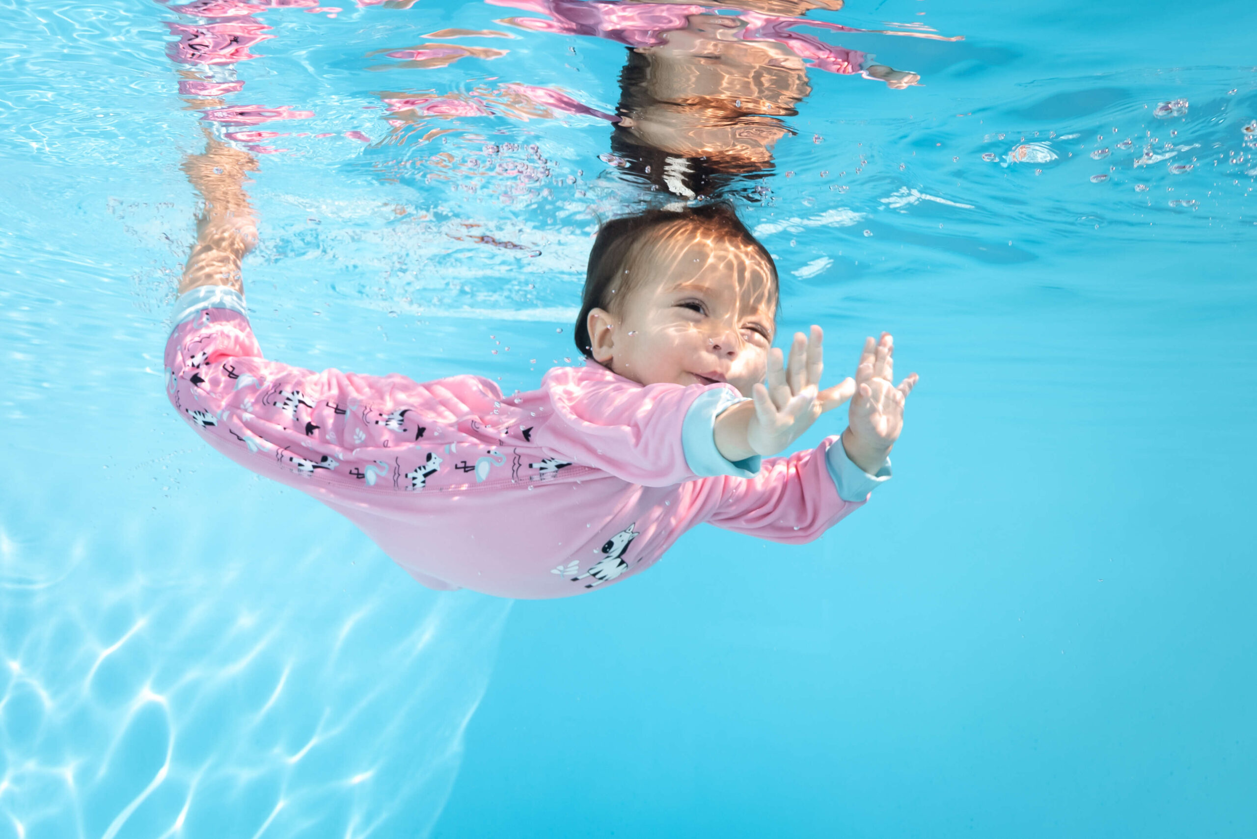 baby swimming in splash about clothing